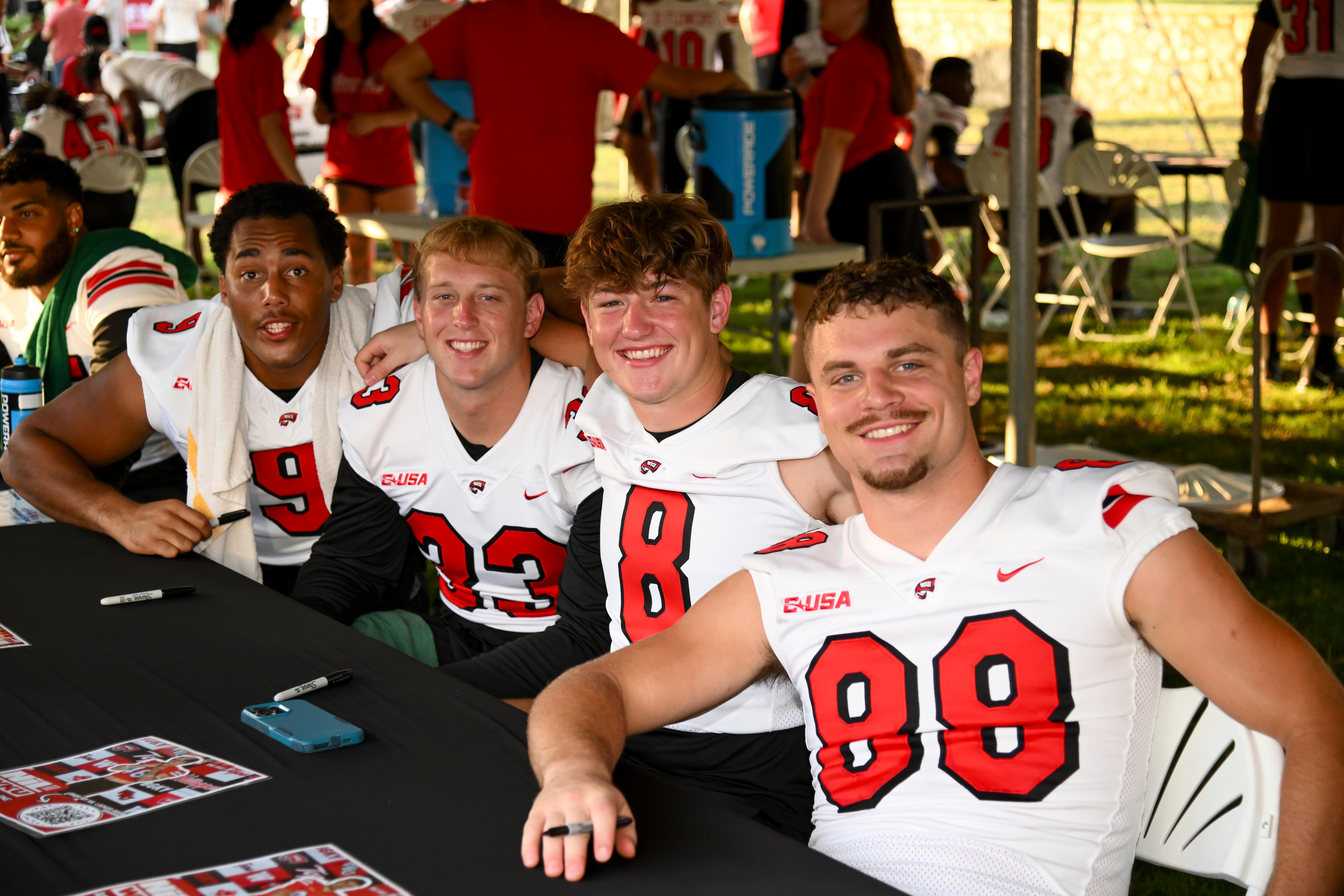 WKU student-athletes posing for a group photo at Topper Fest
