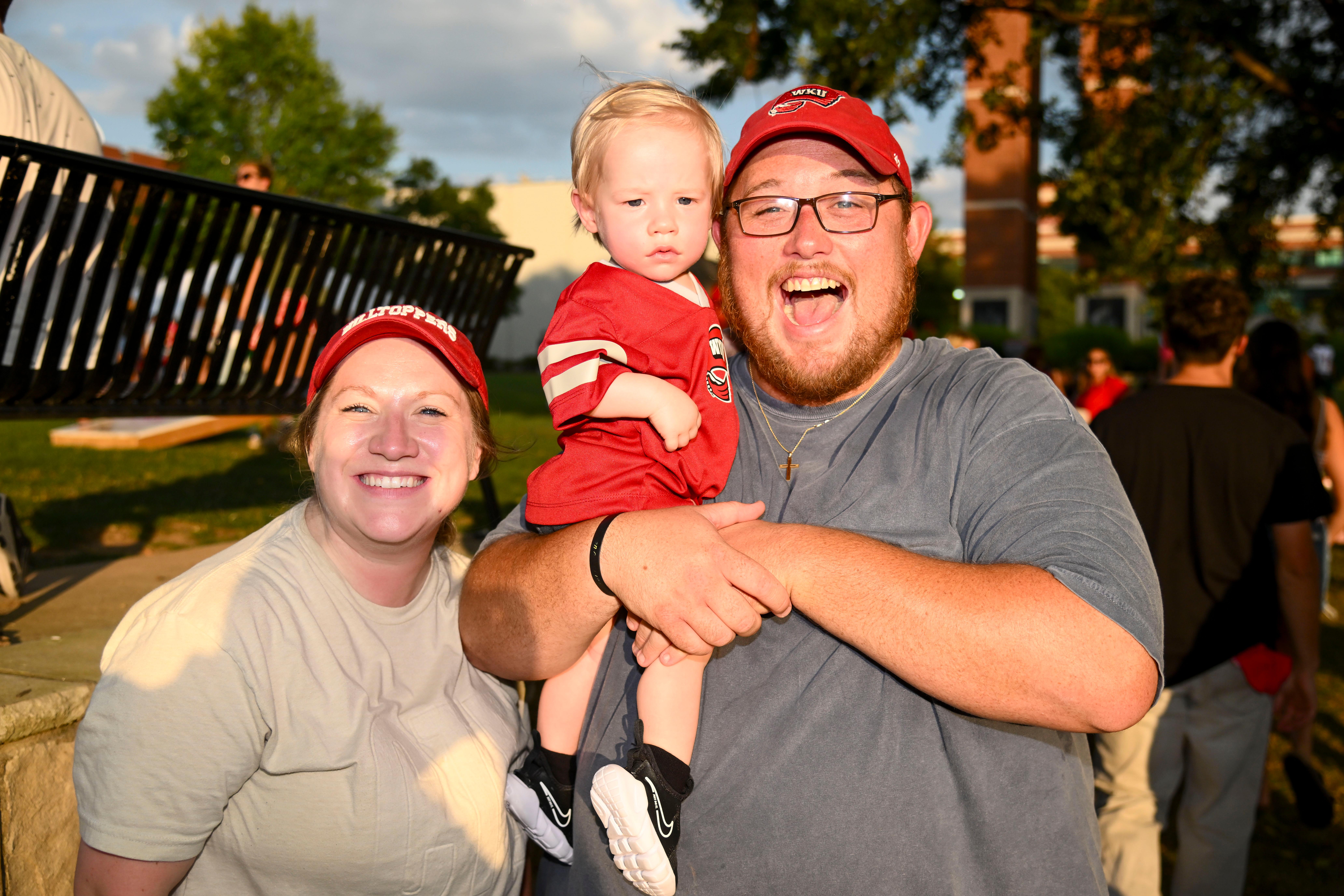 Family posing for a group photo at Topper Fest