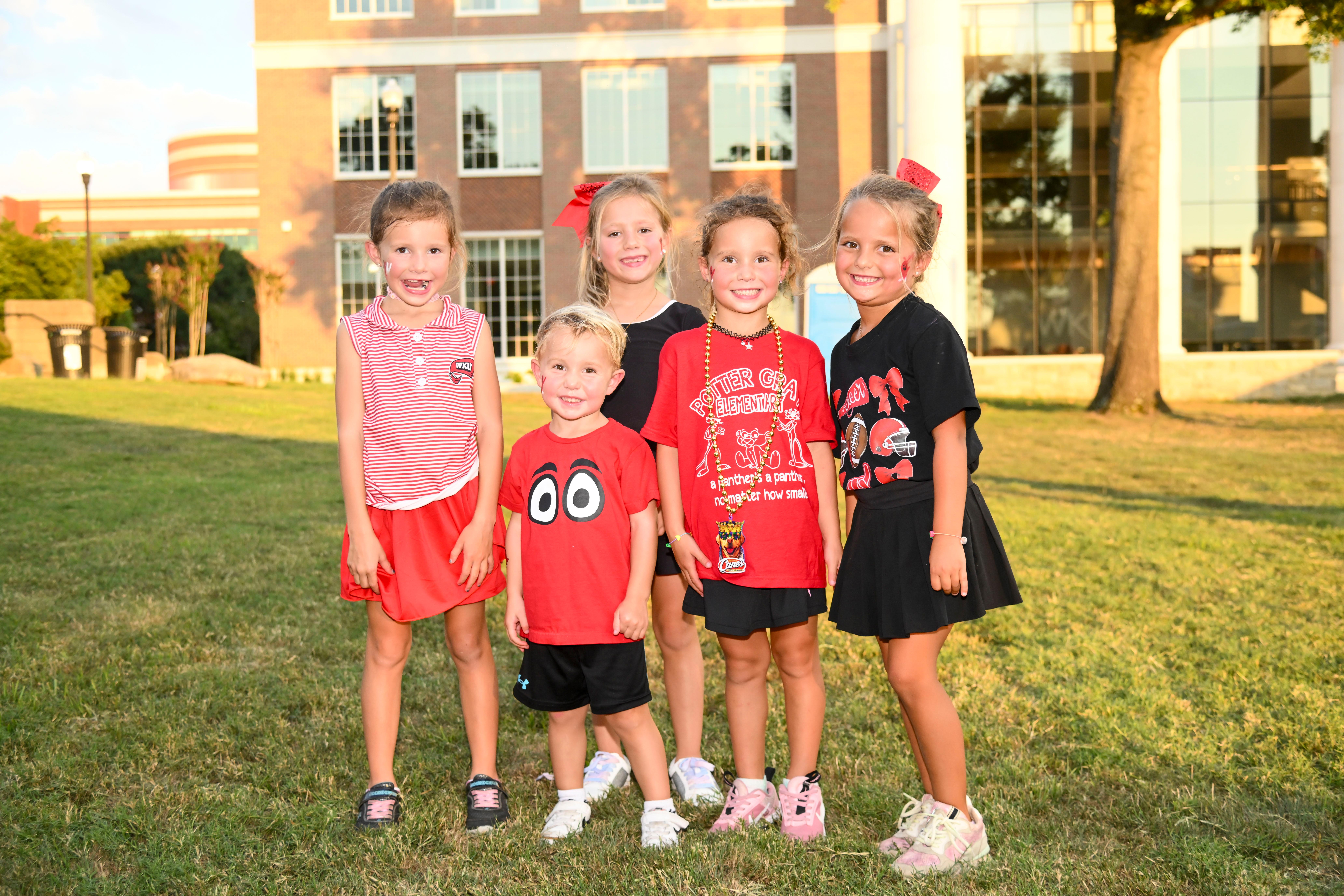 Children posing for a group photo at Topper Fest