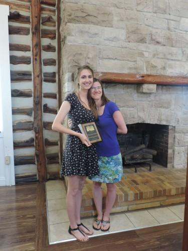Nicole Brazeale awards Alexandria Goldsmith the Seneca Falls Personal Empowerment Award