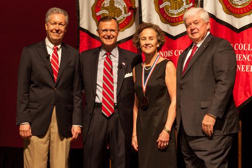 Dr. Betsy Shoenfelt (third from left) was recognized as University Distinguished Professor. Participating in the presentation (from left) were Provost David Lee, President Gary Ransdell and Regents Chair Freddie Higdon. (WKU photo by Clinton Lewis)
