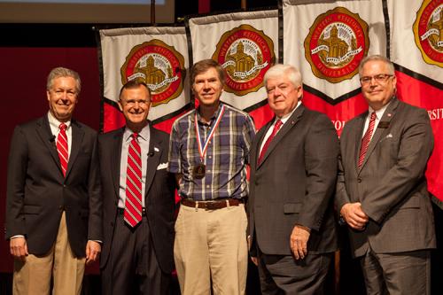 Dr. Tom Richmond (center) was recognized as University Distinguished Professor. Participating in the presentation (from left) were: Provost David Lee, President Gary Ransdell, Regents Chair Freddie Higdon and Marc Archambault, Vice President for Development and Alumni Relations. (WKU photo by Clinton Lewis)