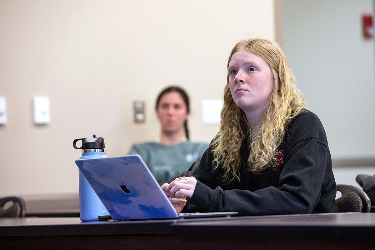 Student sitting in the Organizational Leadership Program class.