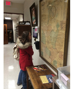 Student looking at 1877 Map of Warren County