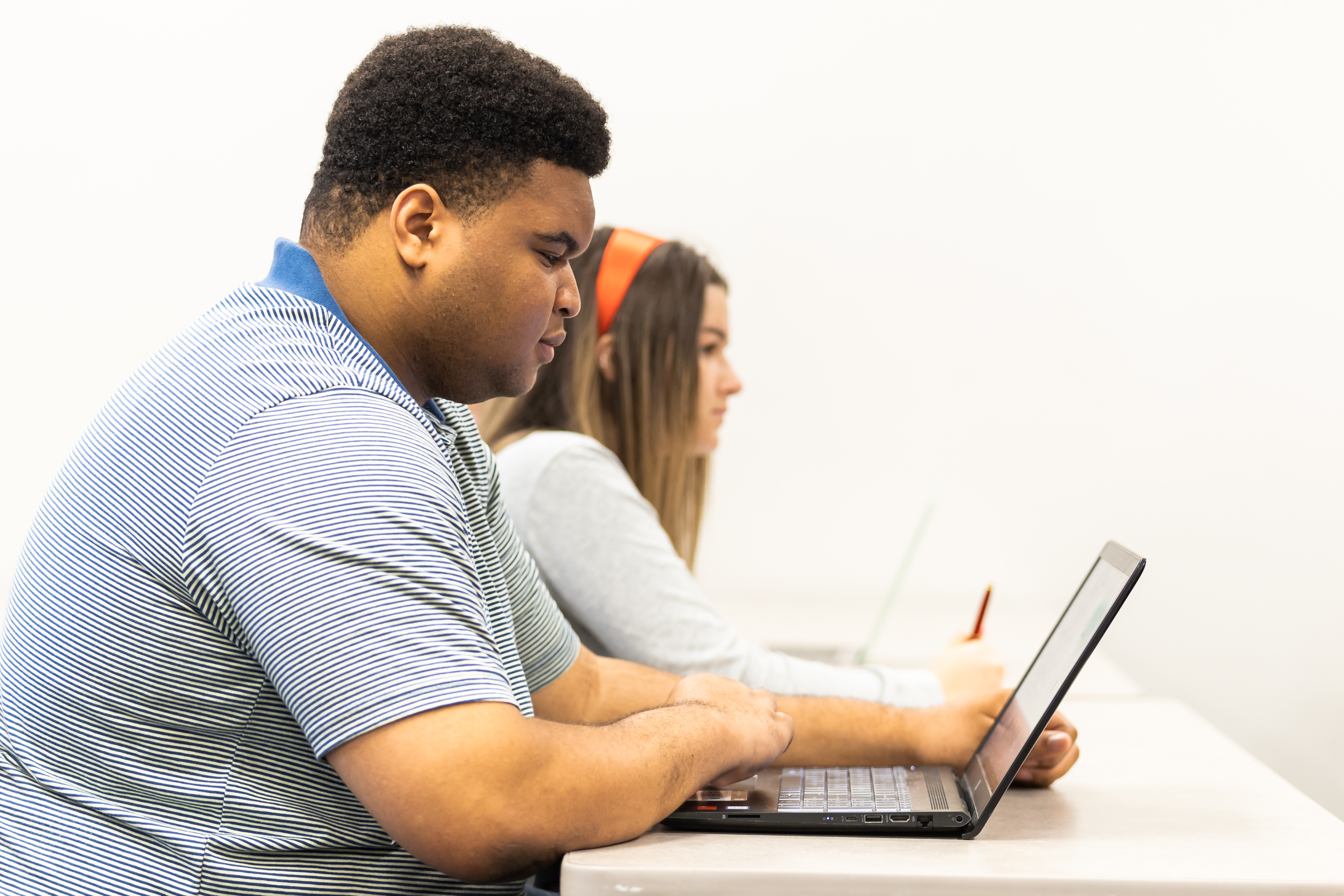 WKU student works on a laptop in class.