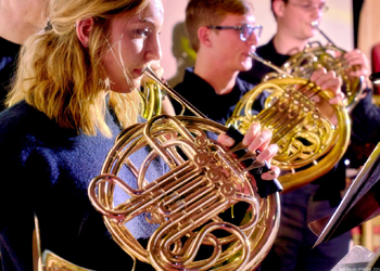 people playing french horns