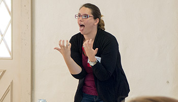 Presenter emphasizing the use of facial expression in storytelling