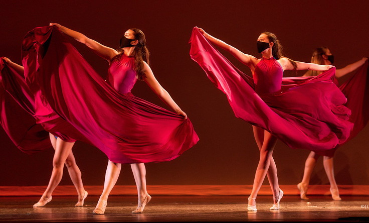 Dancers in red dresses.