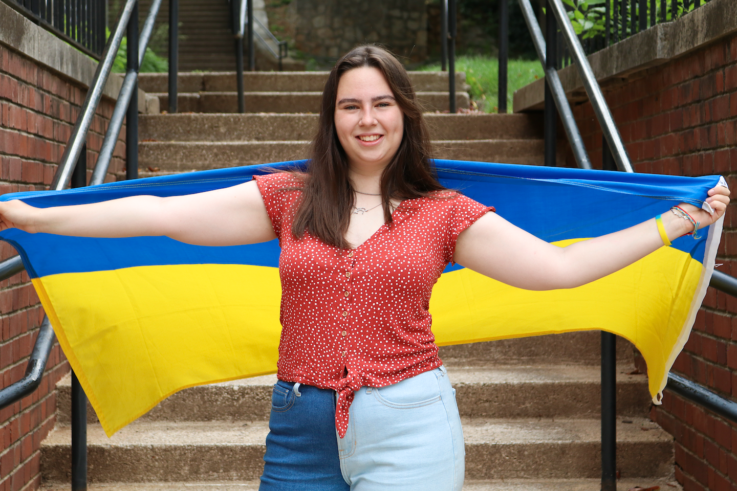 Mariia holding Ukrainian flag