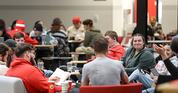 students sitting in WKU Commons eating and talking