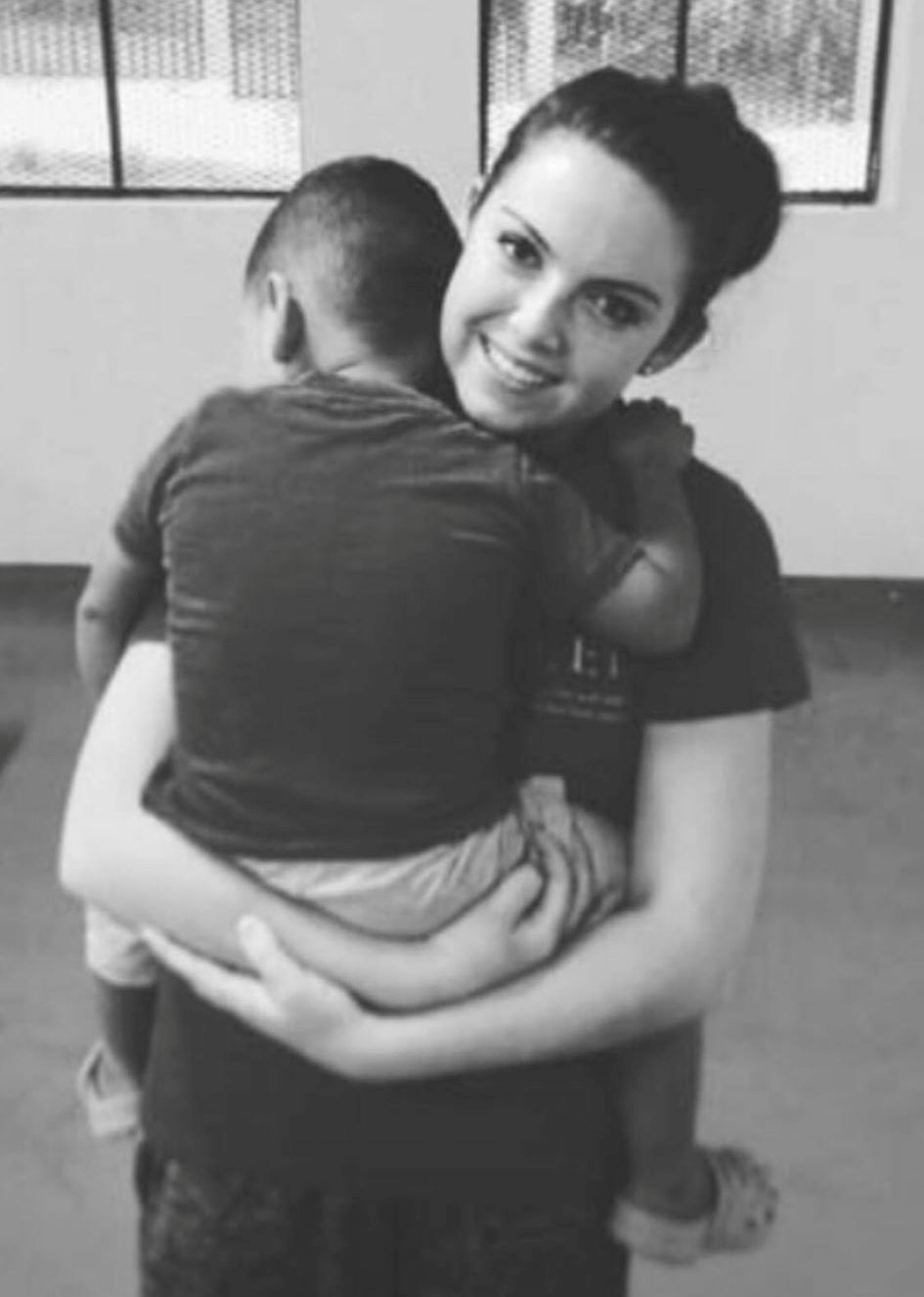 Former WKU student Meagan Ferguson holds a child.