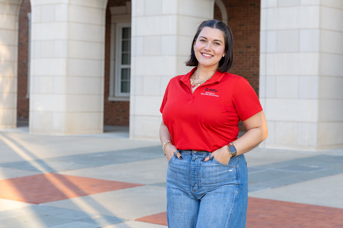 ABA Student standing in front of Gary Ransdell Hall.