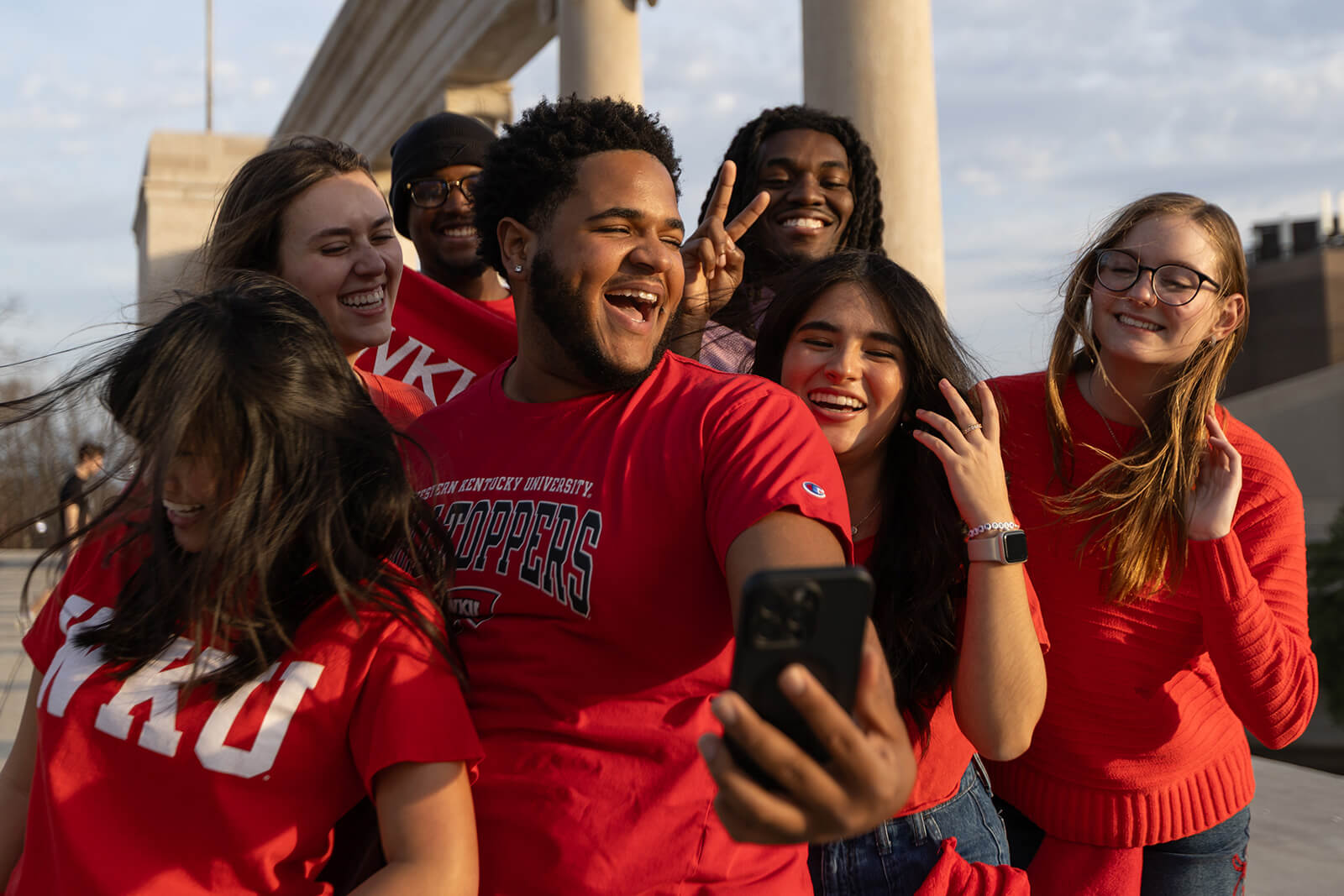 WKU Students taking a selfie in front of the colonnade