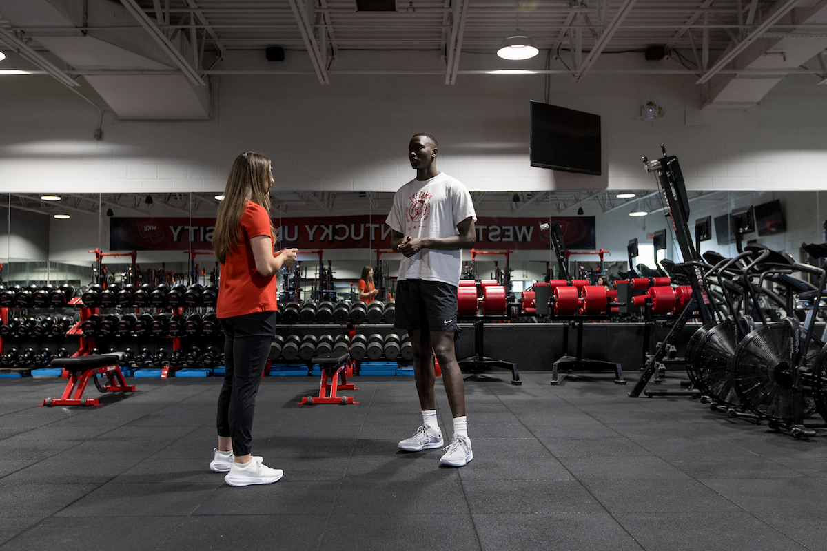 A WKU student athlete talks to a Student Athlete Success Center representative.