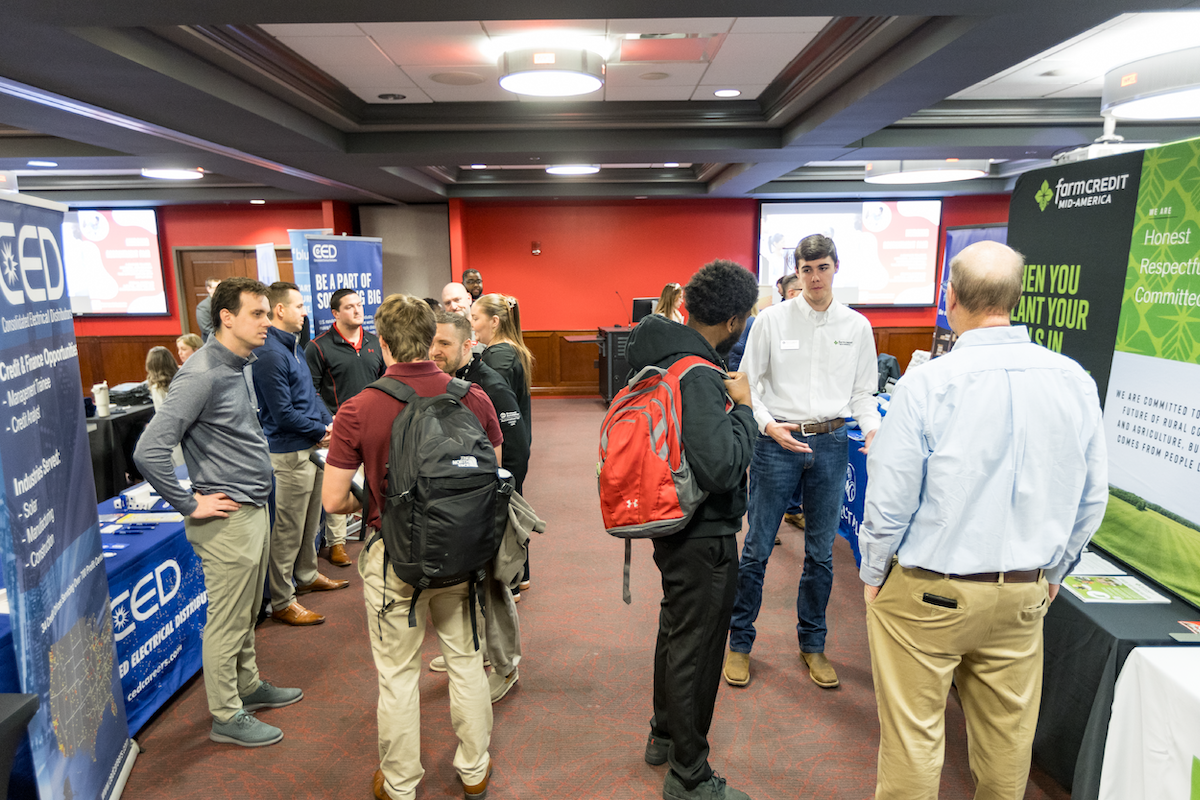 WKU students speak to business representatives at an internship fair.