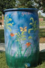 rain barrel painted by Quinna howdoesyourgarden