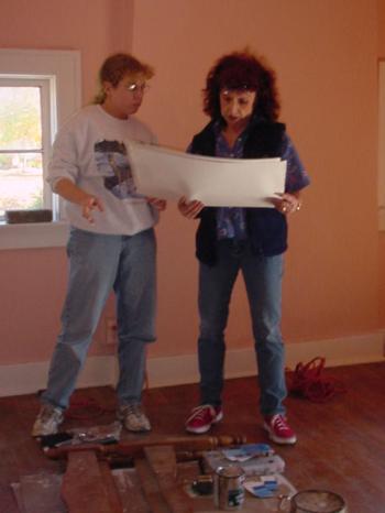 Catron Peterson and Judy Chicago with heads together